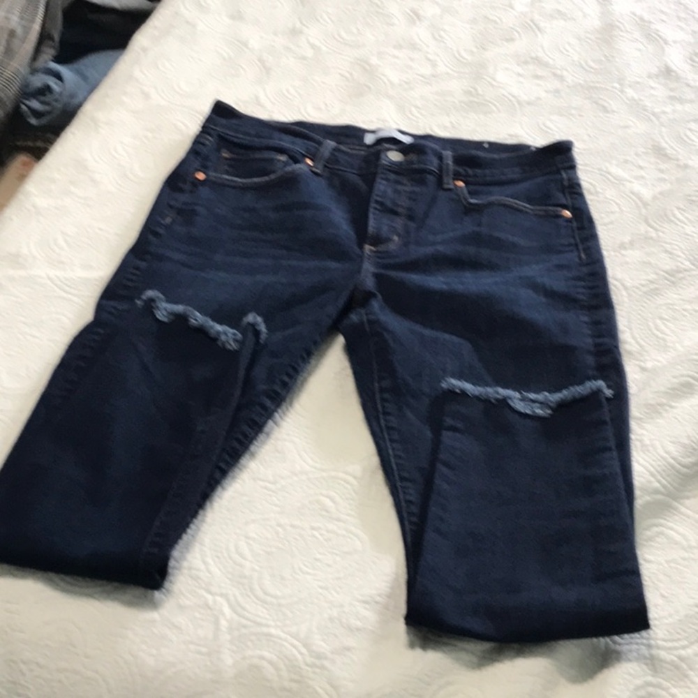 Like new Loft skinny jeans with fringe hem